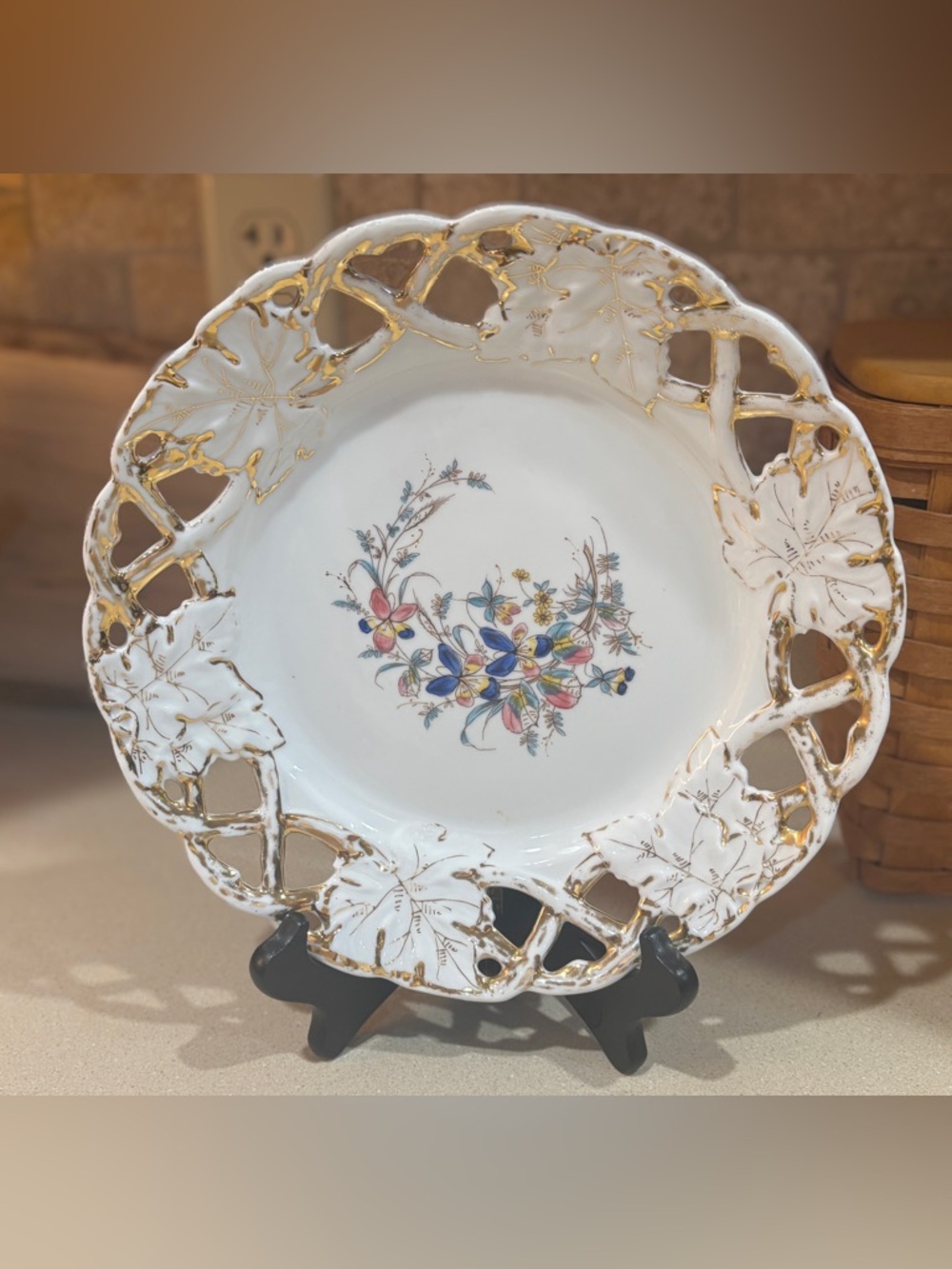 A vintage reticulated porcelain plate